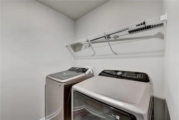 a view of a house with trees in the background