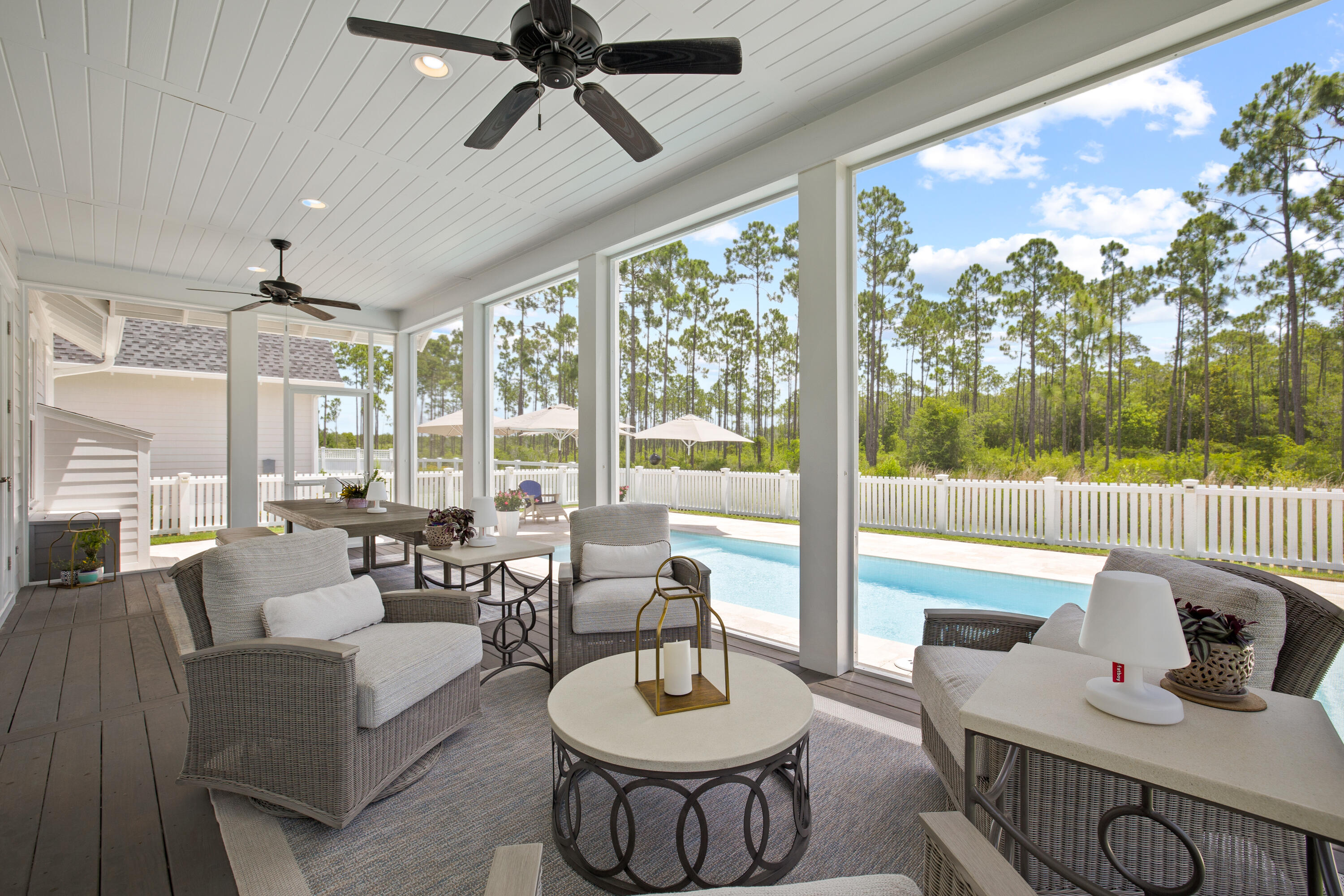57 Sapling St Inlet Beach Inlet Beach, FL 32461 - Photo 3 of 55 a living room with furniture and a floor to ceiling window