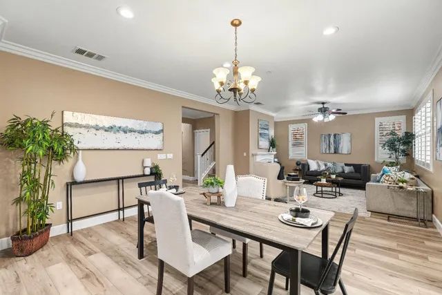 a kitchen with granite countertop a sink stove and refrigerator