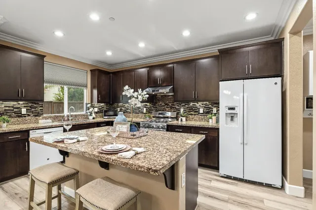 a view of a kitchen and dining table