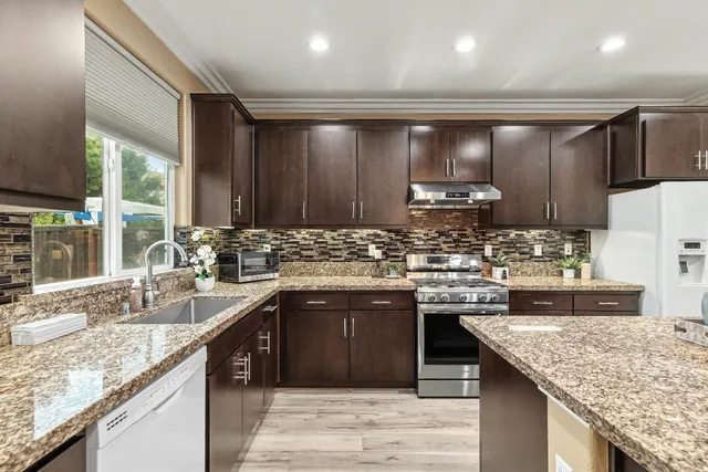a view of an entryway with wooden floor and door