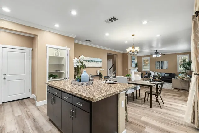 a bathroom with a sink vanity mirror and toilet
