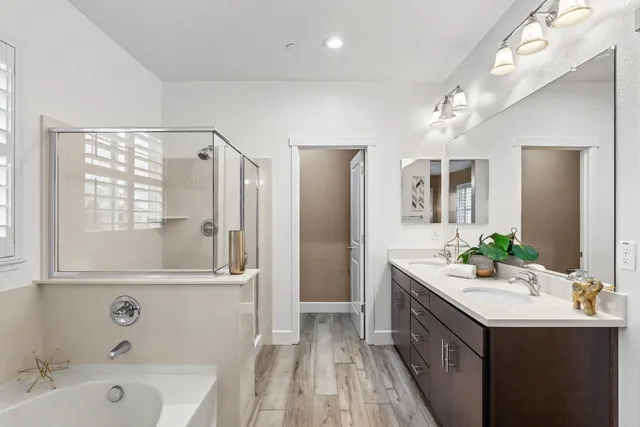 a bathroom with a sink toilet a mirror and shower