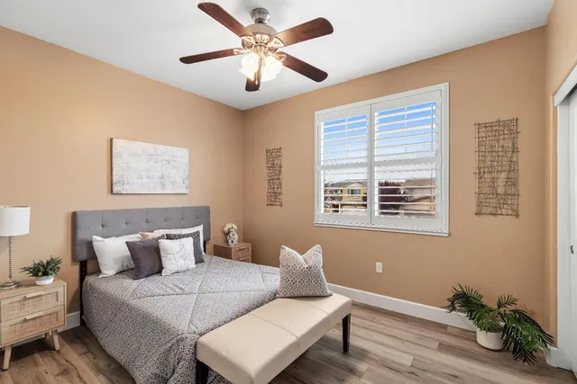 a view of a swimming pool with a patio and a garden