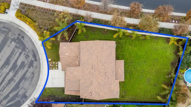 a view of swimming pool with a table and chairs