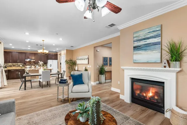 a dining room with furniture window and wooden floor