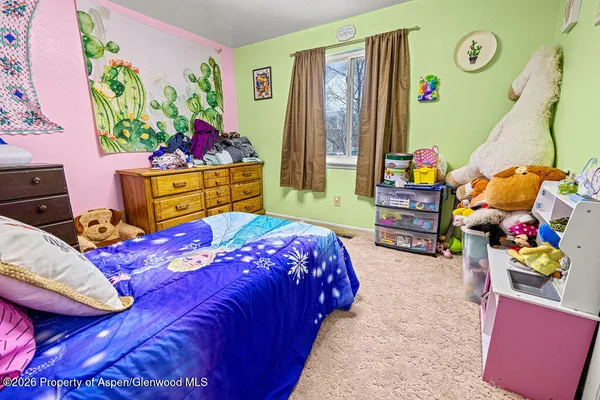 a bathroom with a sink toilet and mirror