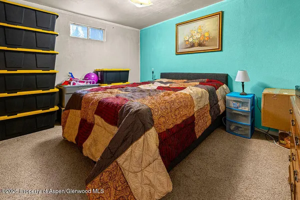 a bathroom with a sink a mirror and a shower