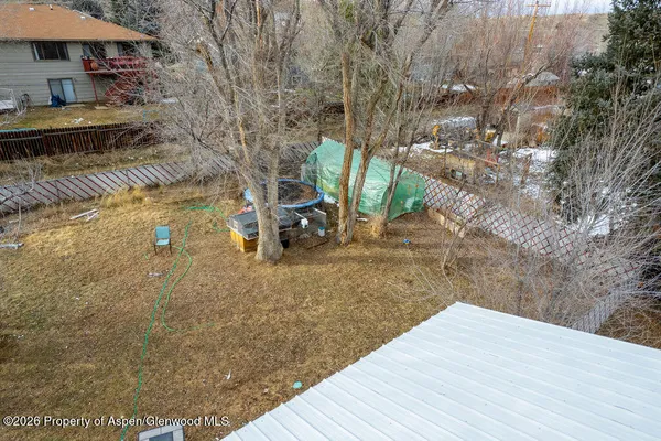 a aerial view of a residential apartment building with a yard