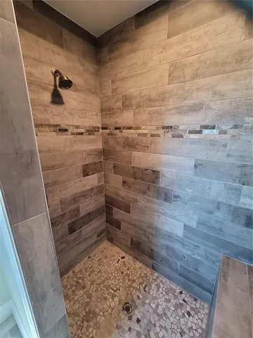 en empty room with wooden floor