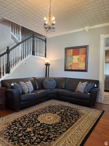 541 300 North Provo, UT 84606 - Photo 9 of 36 Hardwood flooring complements the decorative ceiling with an ornate chandelier