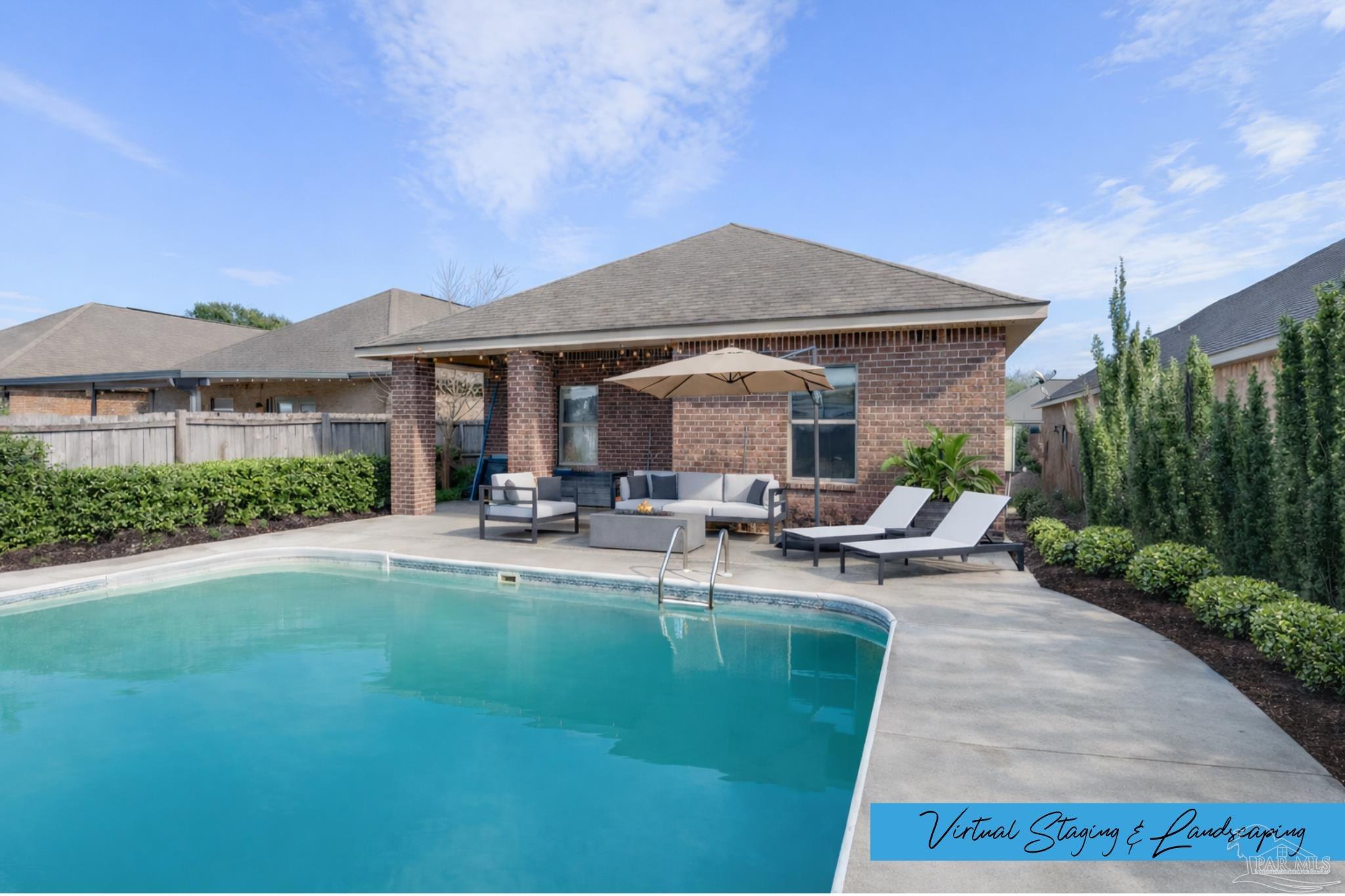 a view of a house with backyard porch and sitting area