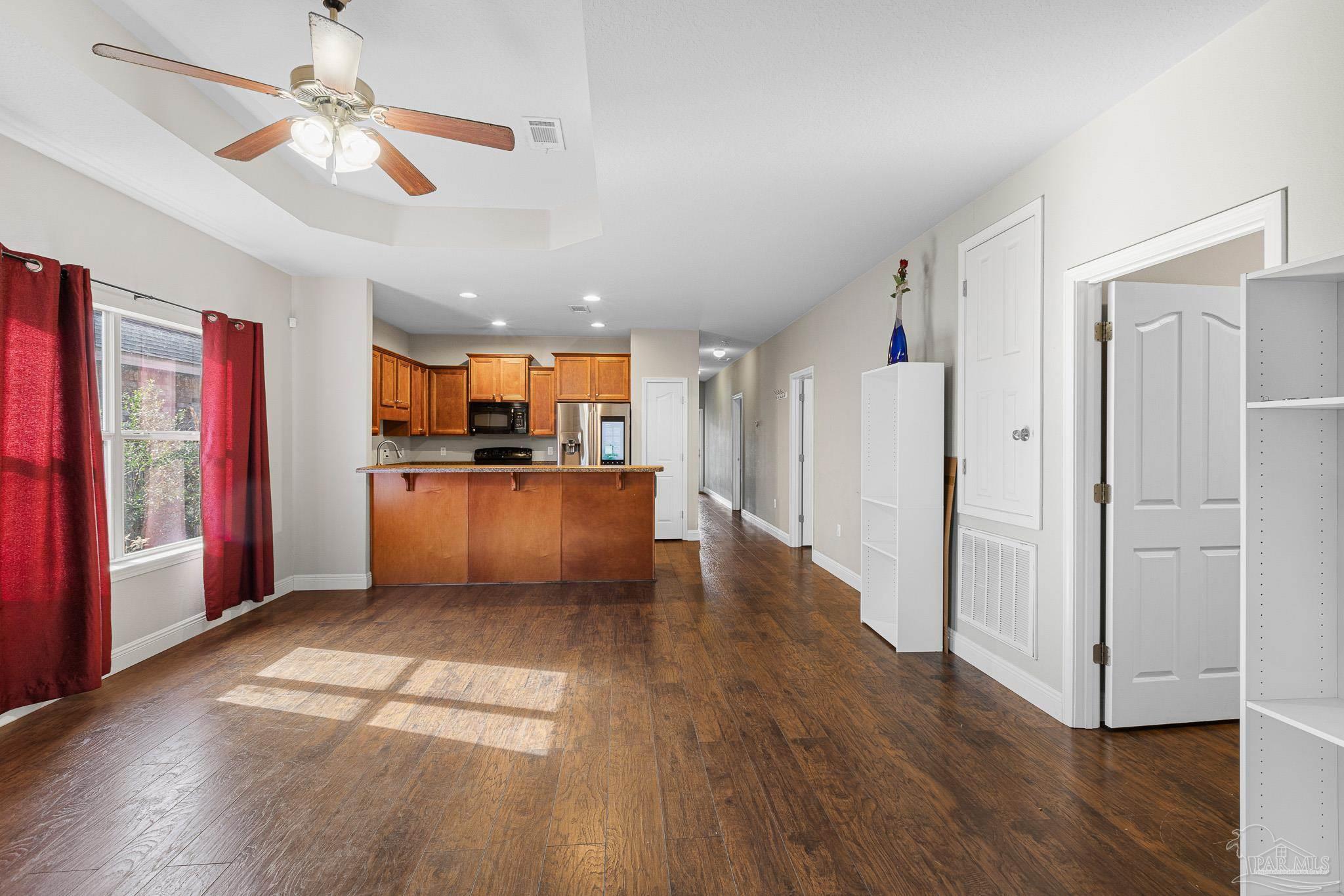 8855 Ridgebrook Court Pensacola, FL 32534 - Photo 11 of 37 a view of a kitchen with wooden floor and a kitchen