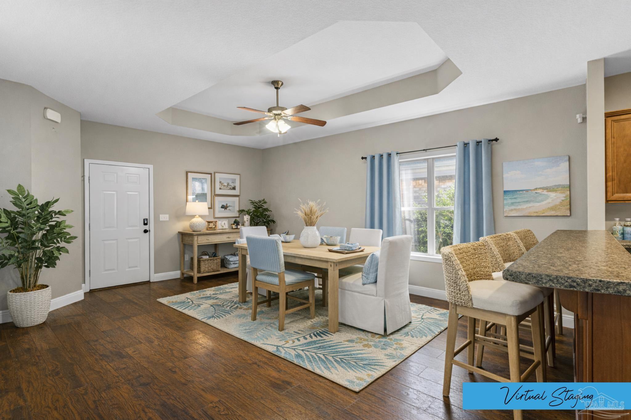 8855 Ridgebrook Court Pensacola, FL 32534 - Photo 15 of 37 a living room with furniture a dining table and a potted plant
