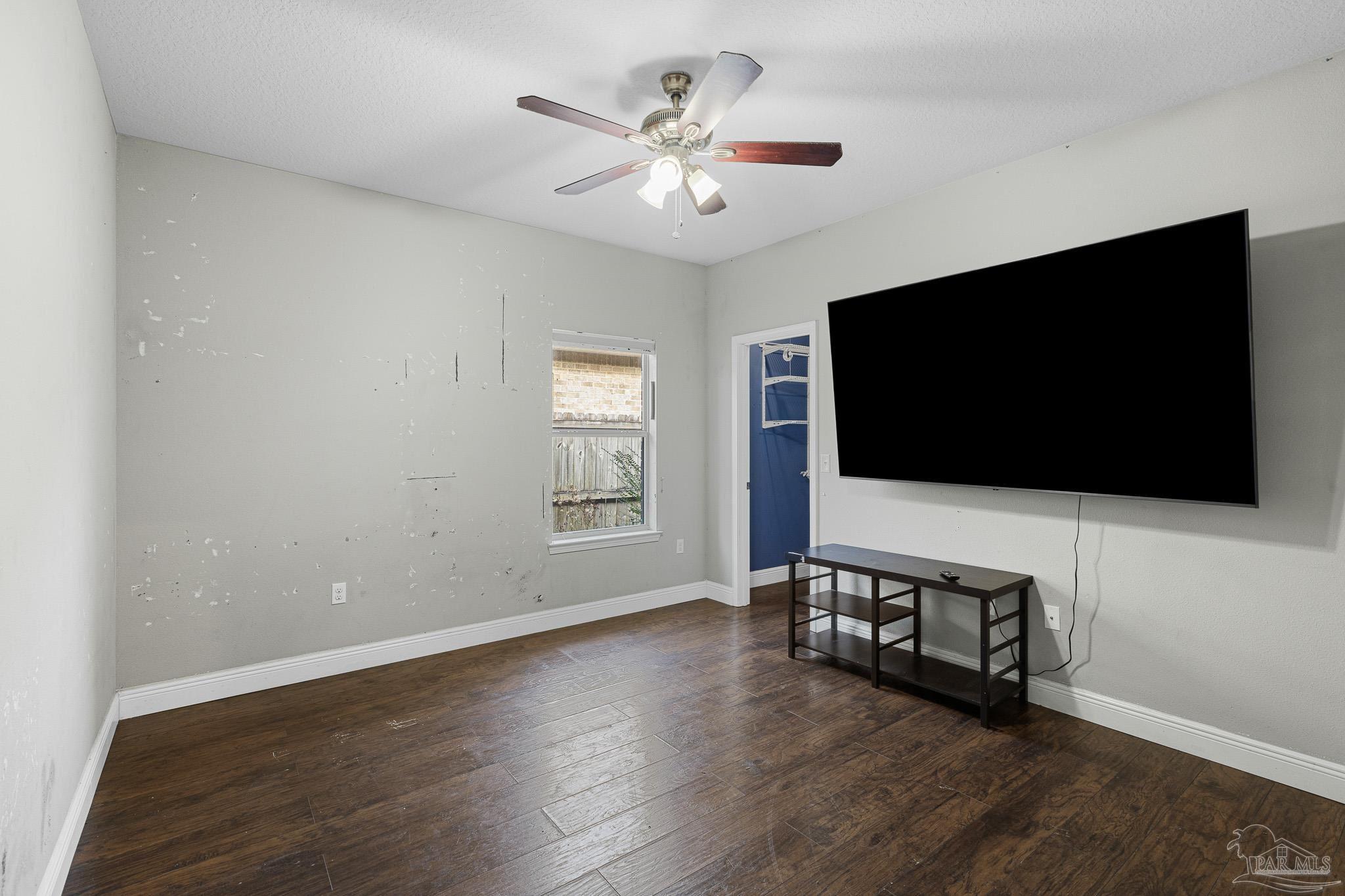 8855 Ridgebrook Court Pensacola, FL 32534 - Photo 24 of 37 a living room with furniture and a flat screen tv