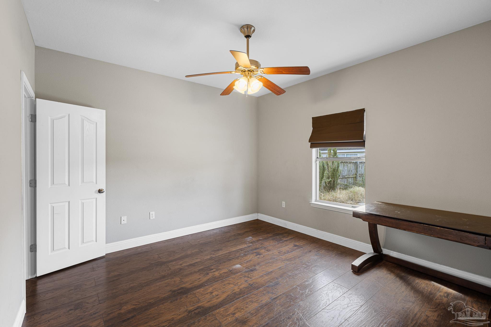 8855 Ridgebrook Court Pensacola, FL 32534 - Photo 29 of 37 a view of room with wooden floor fan and window