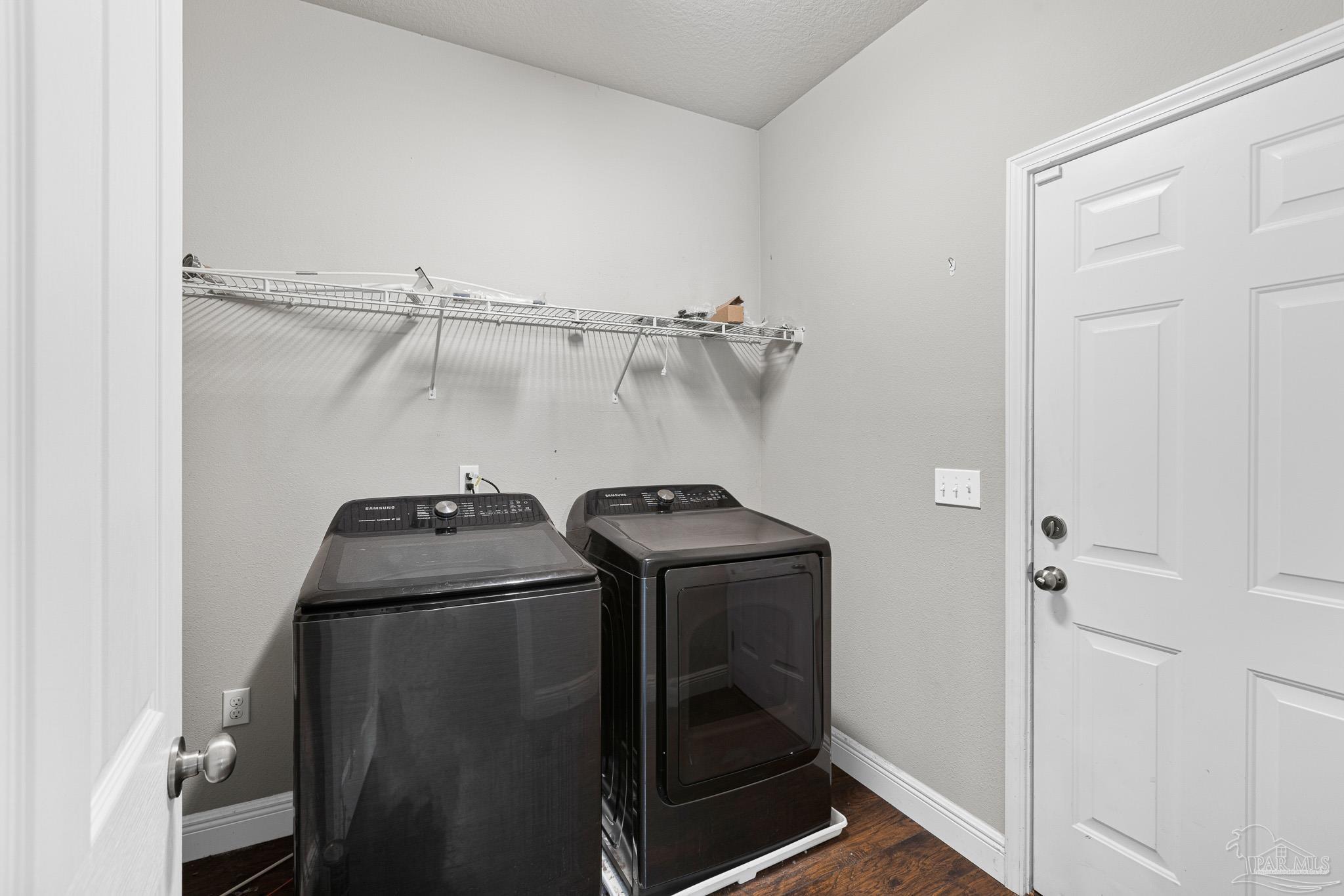 8855 Ridgebrook Court Pensacola, FL 32534 - Photo 32 of 37 a utility room with dryer and washer