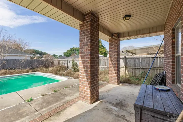 a view of a backyard with sitting area