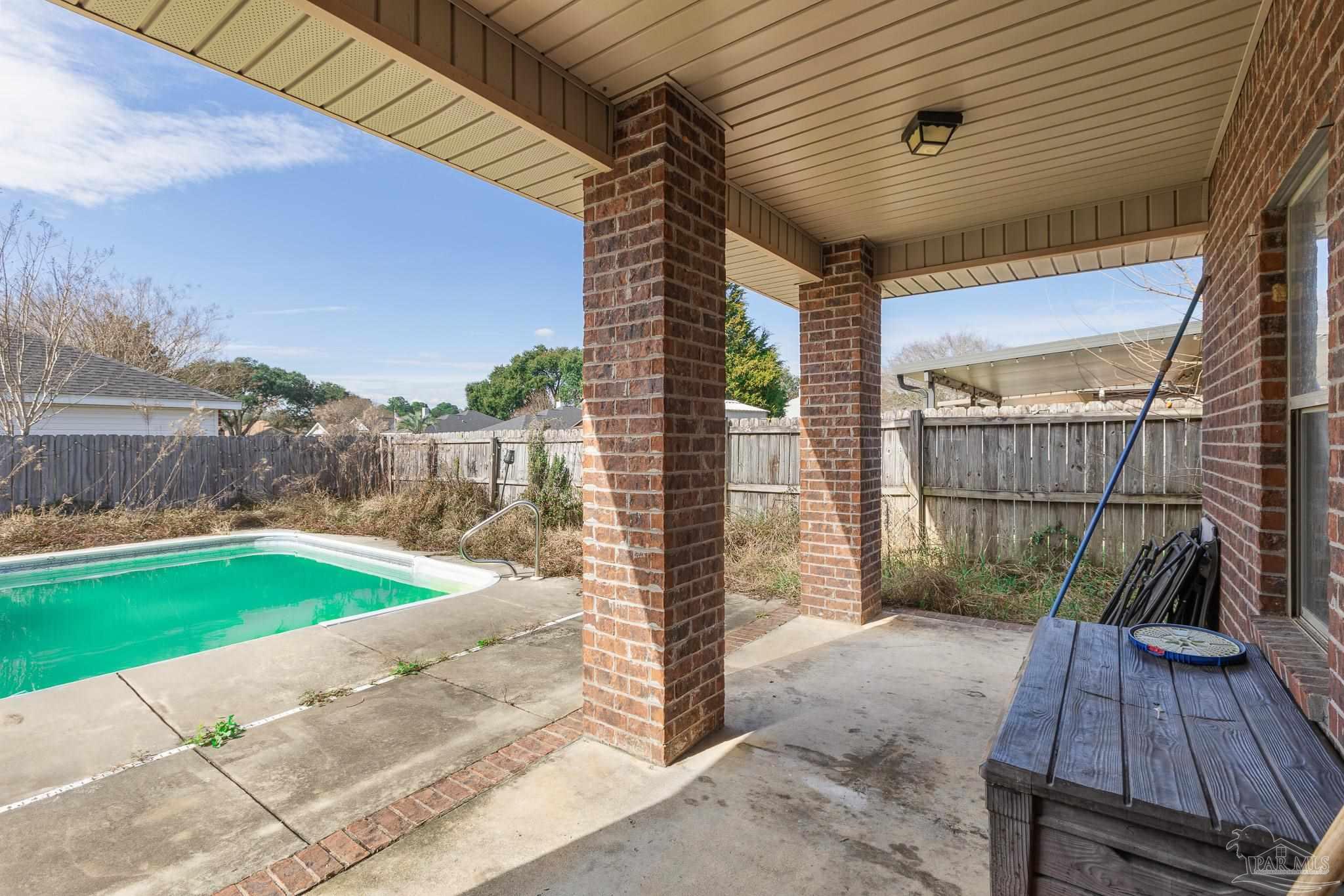 8855 Ridgebrook Court Pensacola, FL 32534 - Photo 36 of 37 a view of a backyard with sitting area
