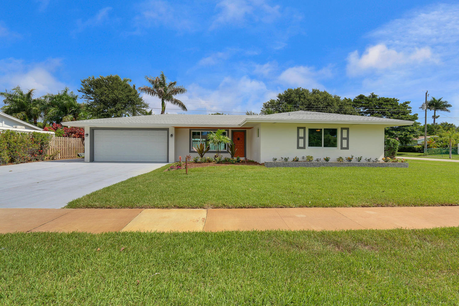 501 Harbour Road North Palm Beach, FL 33408 - Photo 1 of 20 a front view of a house with a garden