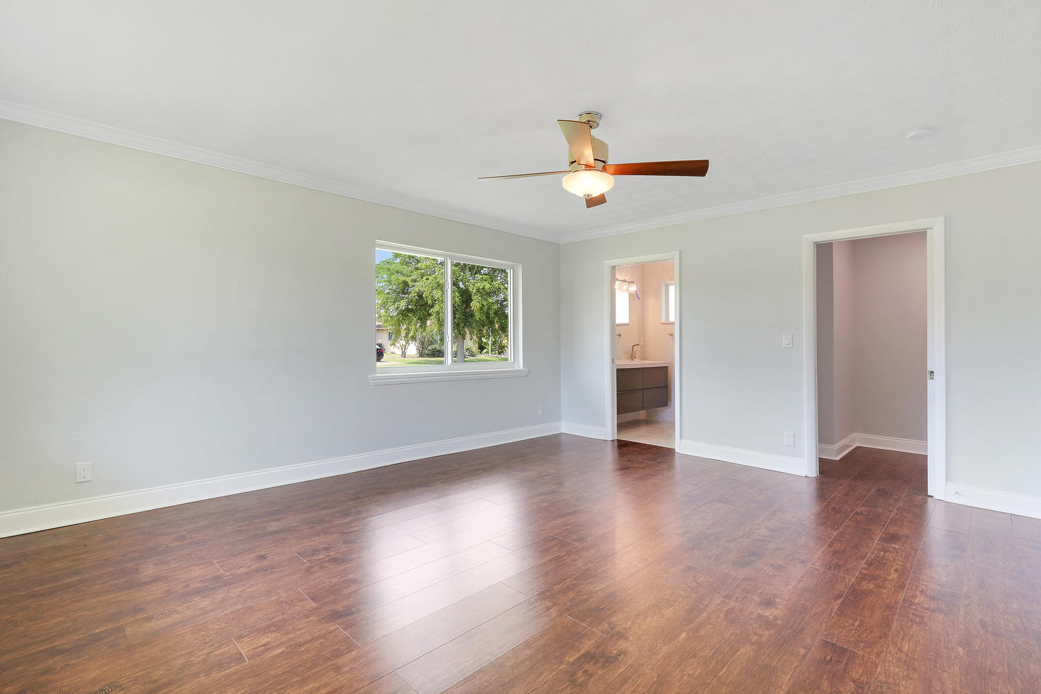 501 Harbour Road North Palm Beach, FL 33408 - Photo 11 of 20 a view of an empty room with a window and wooden floor
