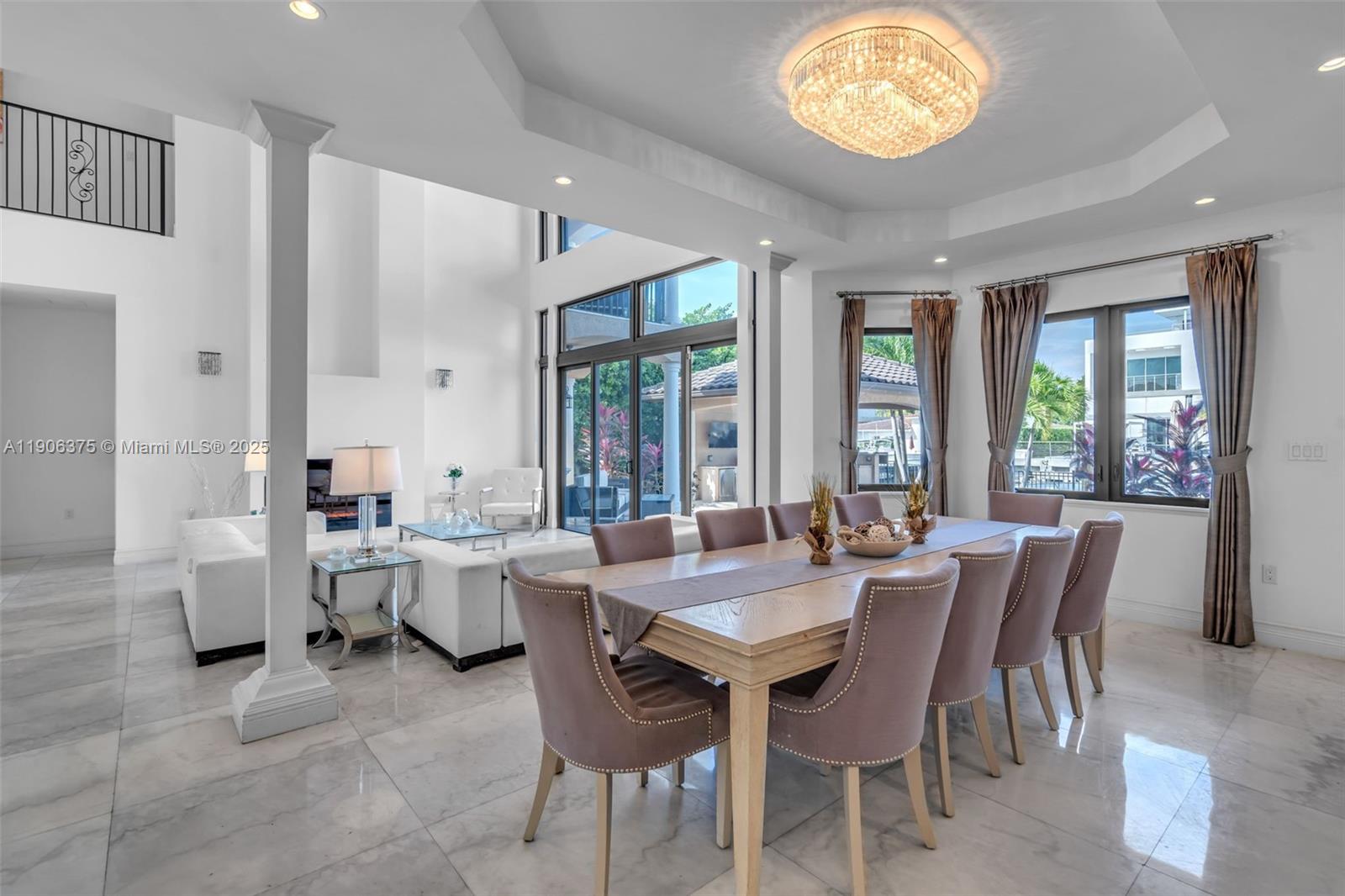 2085 Keystone Boulevard North Miami, FL 33181 - Photo 20 of 77 a view of a dining room with furniture and a large window