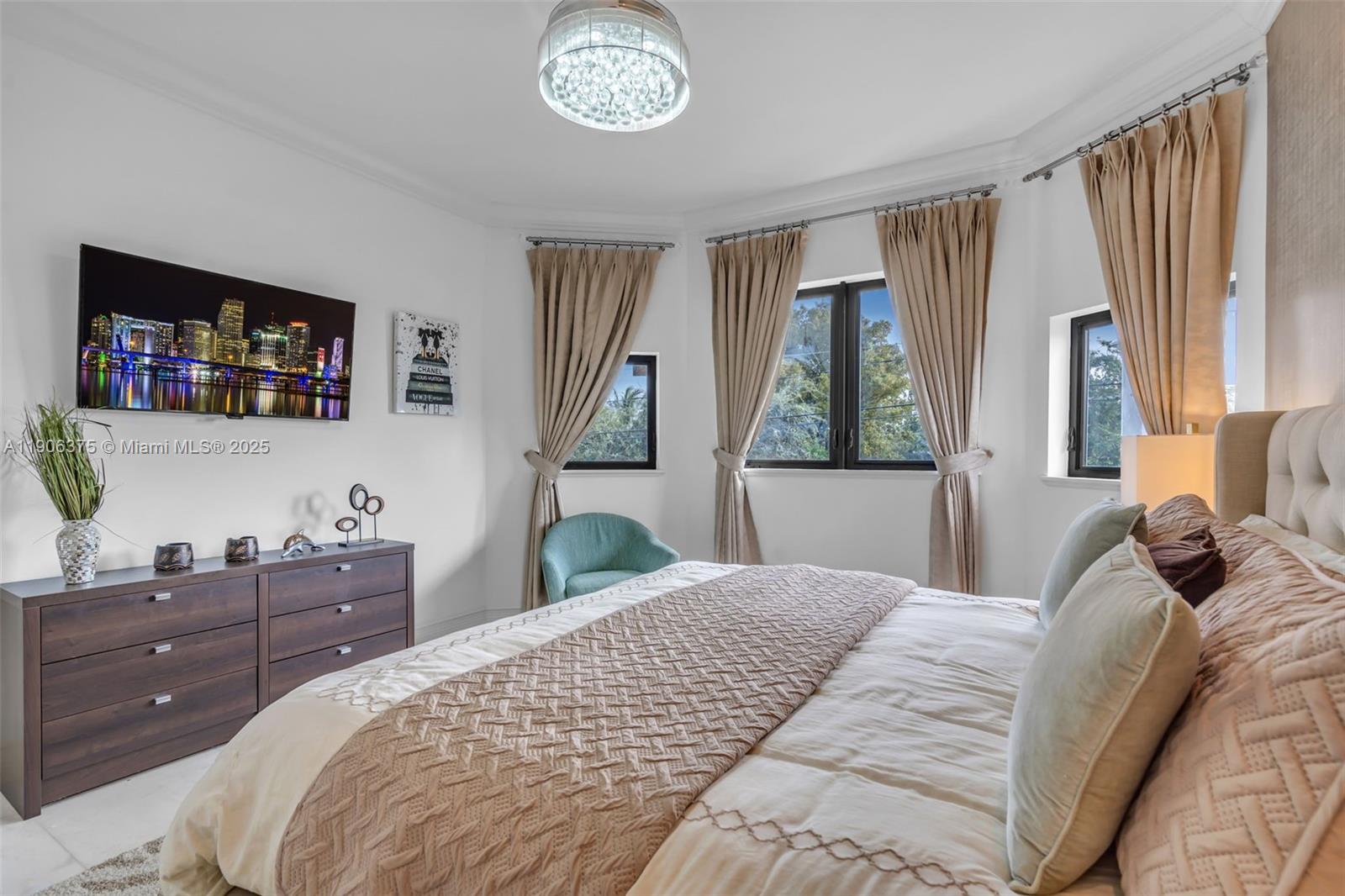 2085 Keystone Boulevard North Miami, FL 33181 - Photo 27 of 77 a bedroom with a bed and a flat tv screen on the dresser