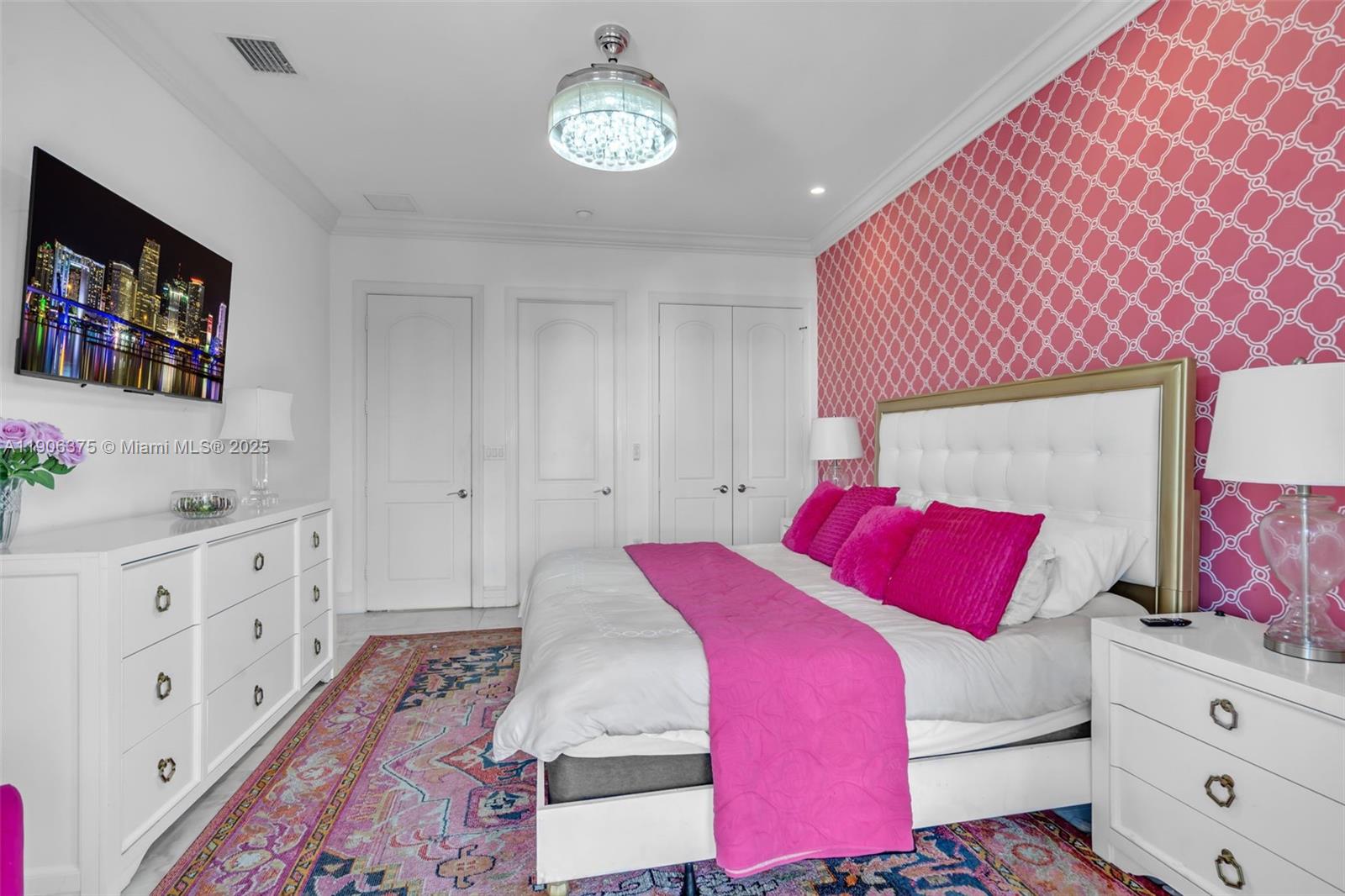 2085 Keystone Boulevard North Miami, FL 33181 - Photo 30 of 77 a bedroom with a bed and a dresser in it