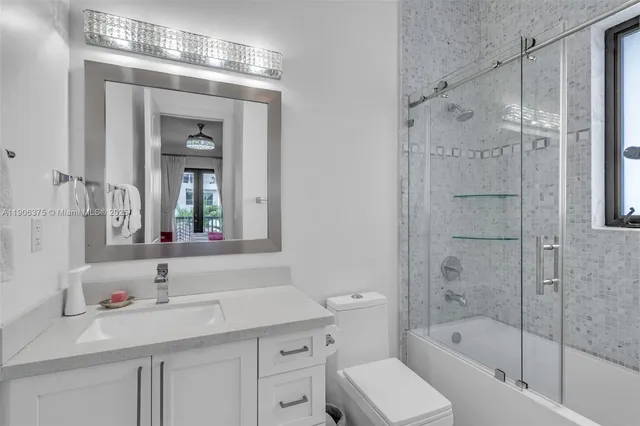 a view of a patio with table and chairs and potted plants
