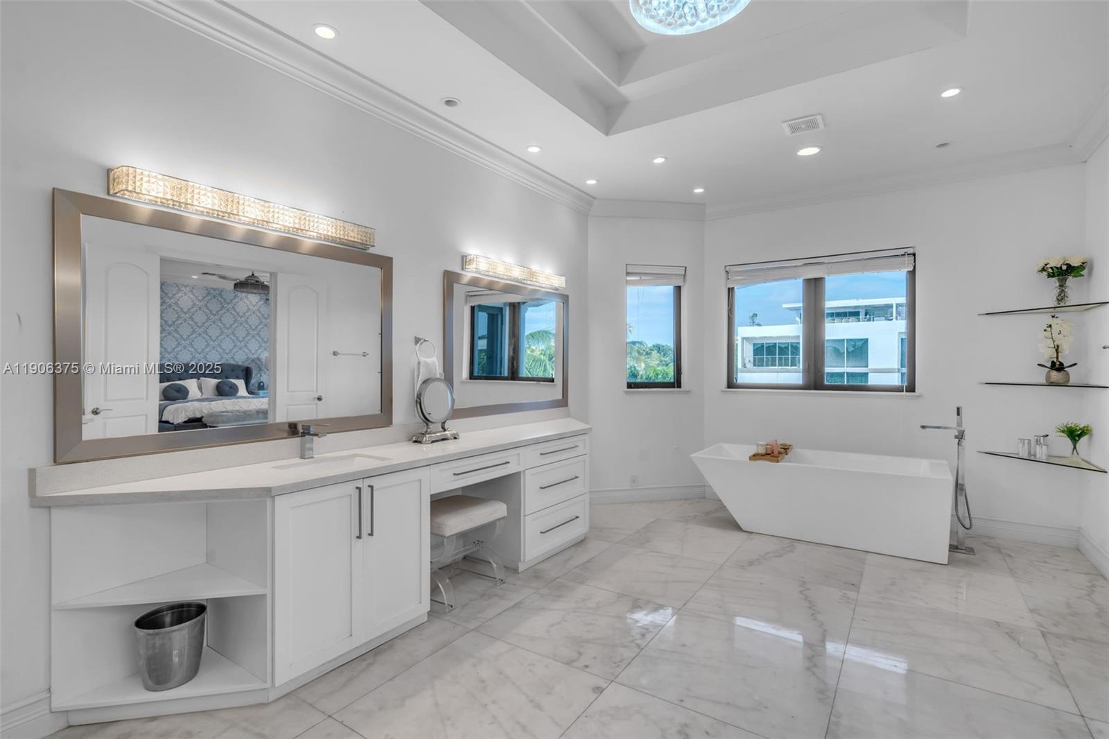 2085 Keystone Boulevard North Miami, FL 33181 - Photo 39 of 77 a large white bathroom with a large tub sink vanity and granite