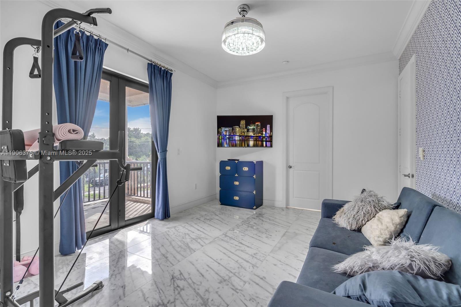 2085 Keystone Boulevard North Miami, FL 33181 - Photo 42 of 77 a living room with furniture a two mirror and a wooden floor