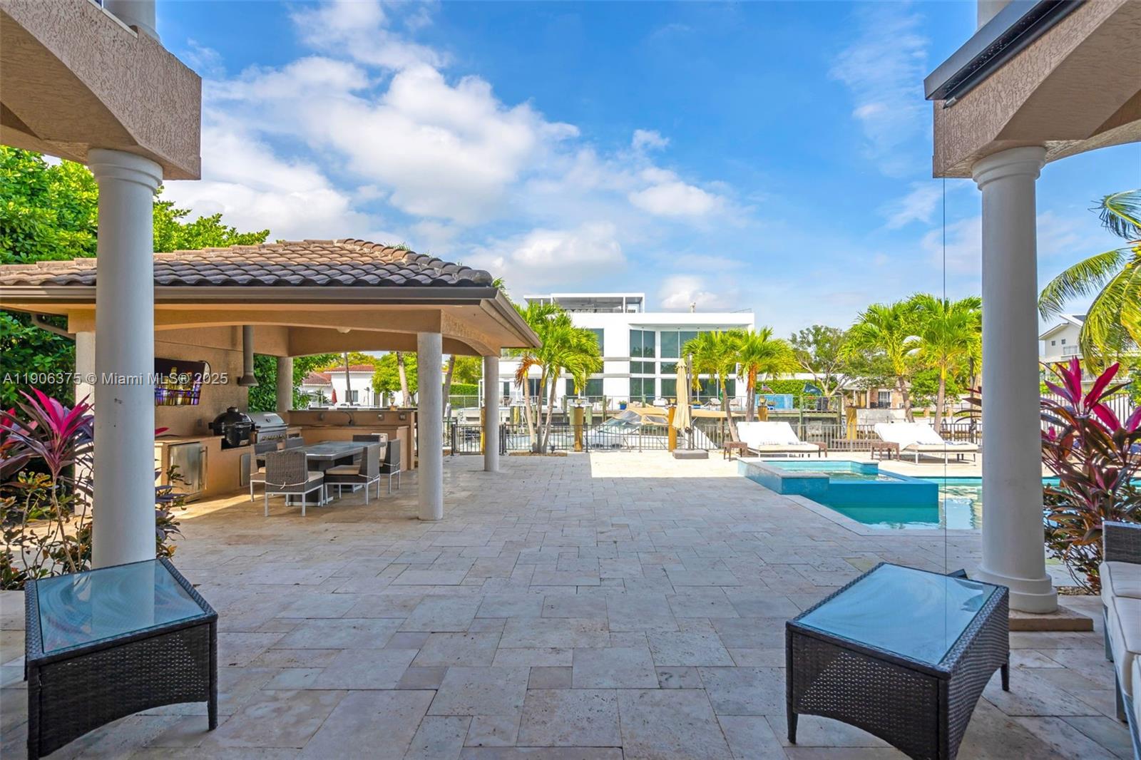 2085 Keystone Boulevard North Miami, FL 33181 - Photo 44 of 77 a view of a patio with table and chairs and potted plants