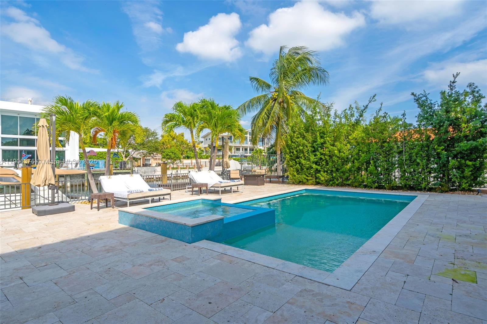 2085 Keystone Boulevard North Miami, FL 33181 - Photo 45 of 77 a view of swimming pool with outdoor seating and plants