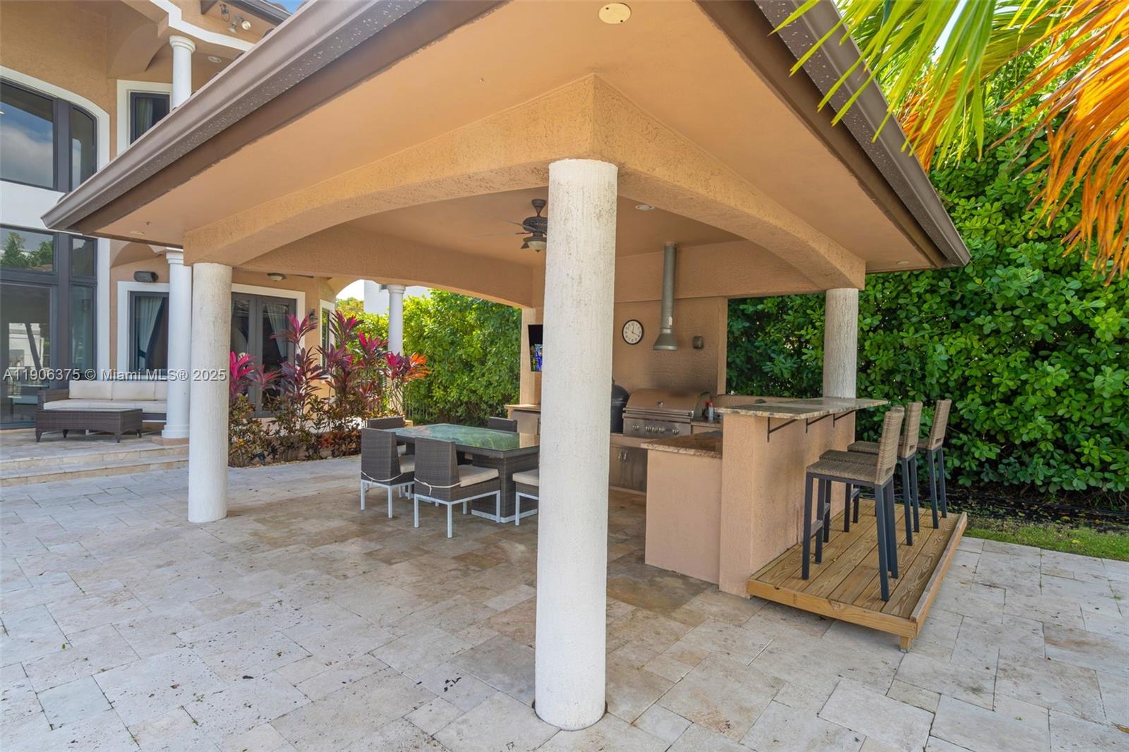 2085 Keystone Boulevard North Miami, FL 33181 - Photo 47 of 77 a view of a patio with table and chairs and potted plants