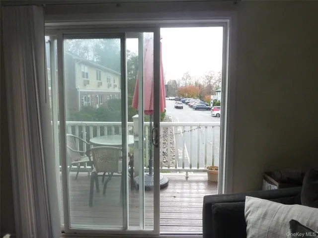 a view of a living room and window