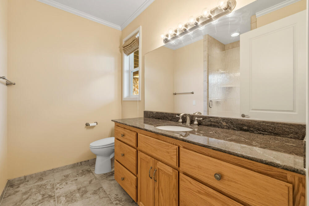 6586 Cooper's Hawk Road Klamath Falls, OR 97601 - Photo 37 of 68 a bathroom with a granite countertop sink and a mirror