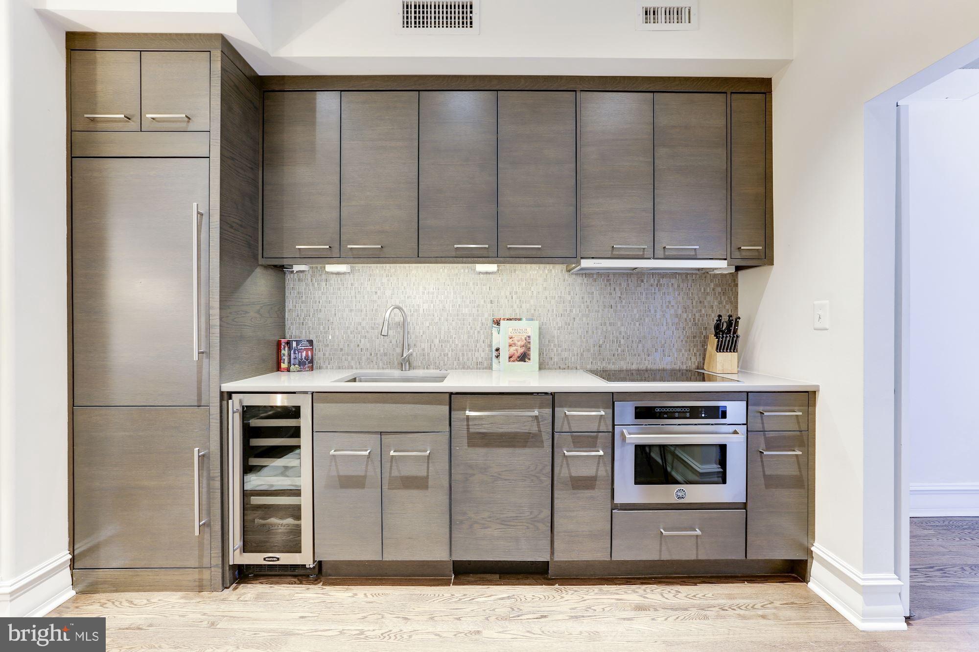 1801 16th Street Northwest, Unit 203 Washington, DC 20009 - Photo 4 of 21 Luxe kitchen equipped w/ SS panelized appliances