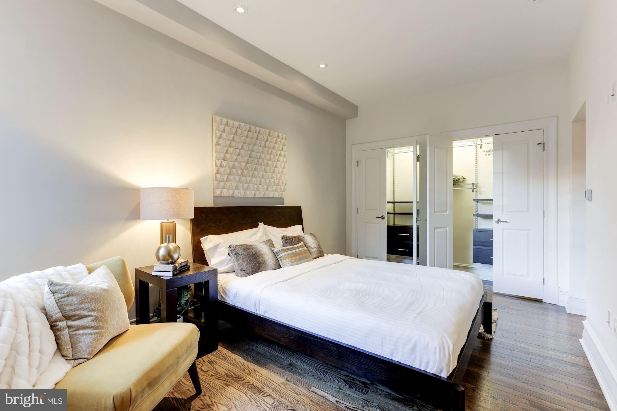 1801 16th Street Northwest, Unit 203 Washington, DC 20009 - Photo 6 of 21 Master bedroom with wall-to-wall custom closets