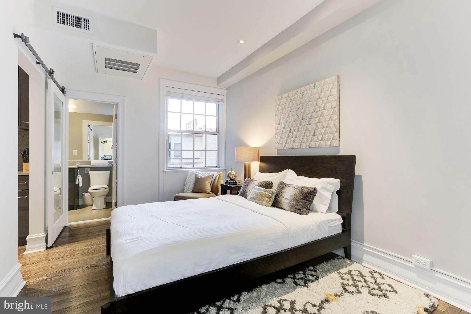 1801 16th Street Northwest, Unit 203 Washington, DC 20009 - Photo 7 of 21 enjoys a designer bath en-suite