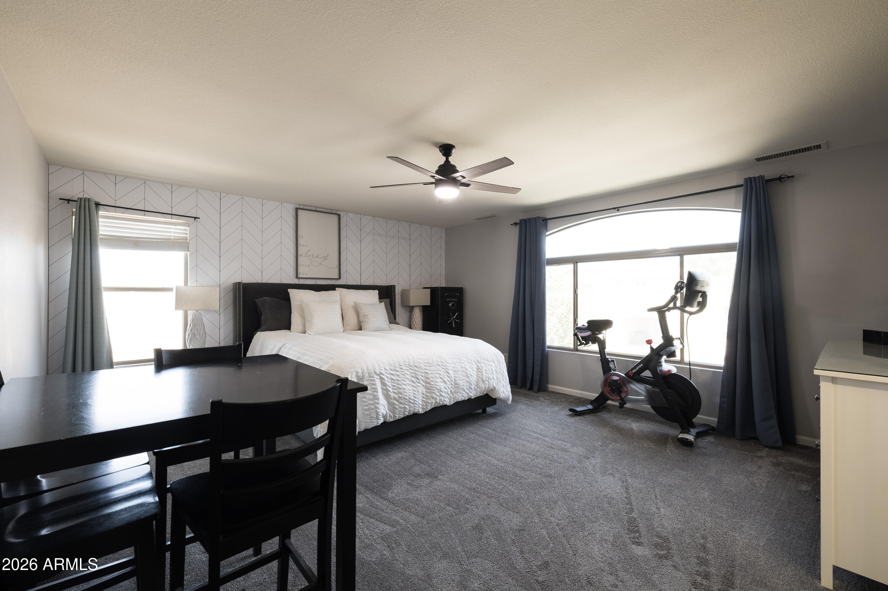 6407 West Saddlehorn Road Phoenix, AZ 85083 - Photo 34 of 41 a bed room with a bed and a table