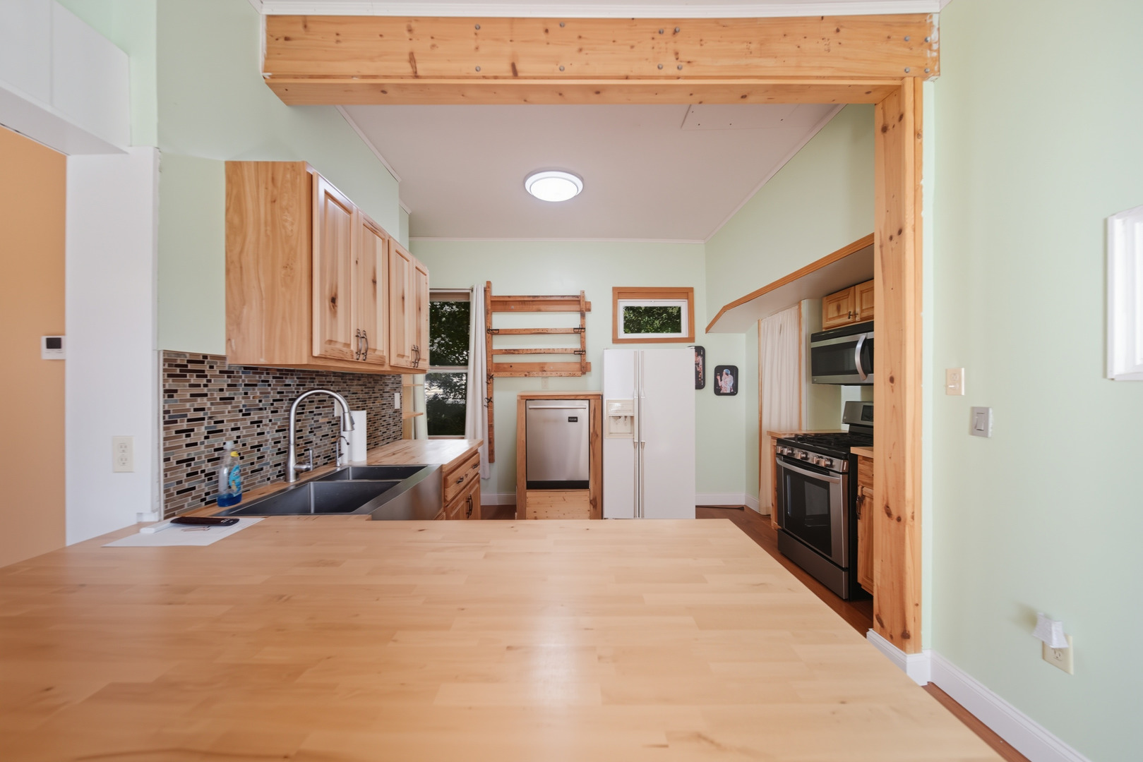 318 East McKenney Street Dixon, IL 61021 - Photo 16 of 36 a kitchen with stainless steel appliances a refrigerator and a stove top oven