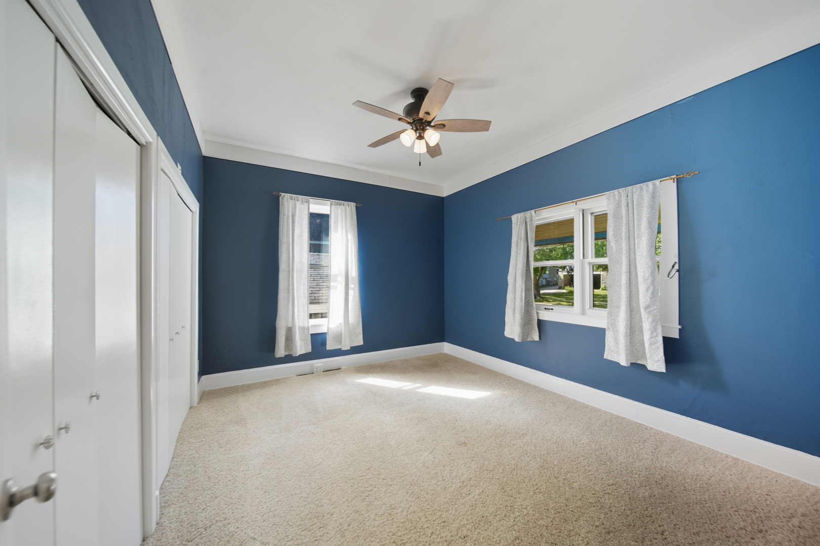 318 East McKenney Street Dixon, IL 61021 - Photo 22 of 36 a view of a livingroom with a ceiling fan and window
