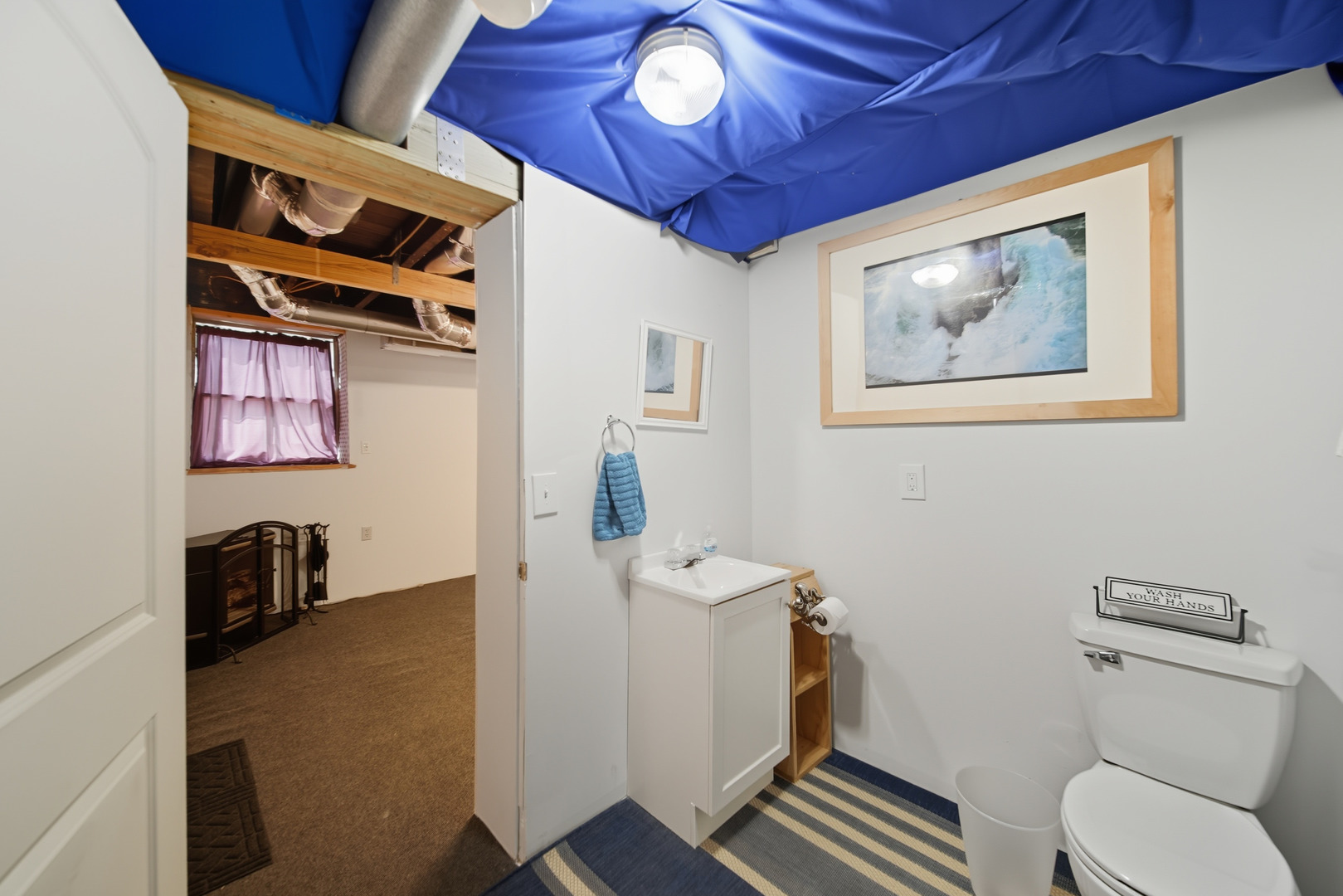 318 East McKenney Street Dixon, IL 61021 - Photo 30 of 36 a bathroom with a toilet a sink and a mirror