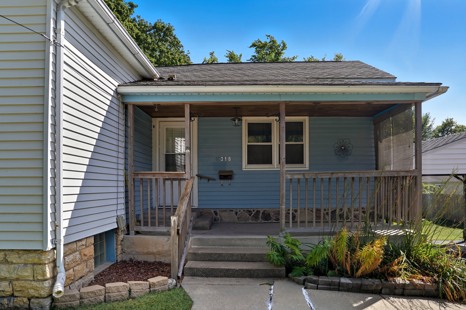 318 East McKenney Street Dixon, IL 61021 - Photo 4 of 36 a view of a house with a small window and potted plants