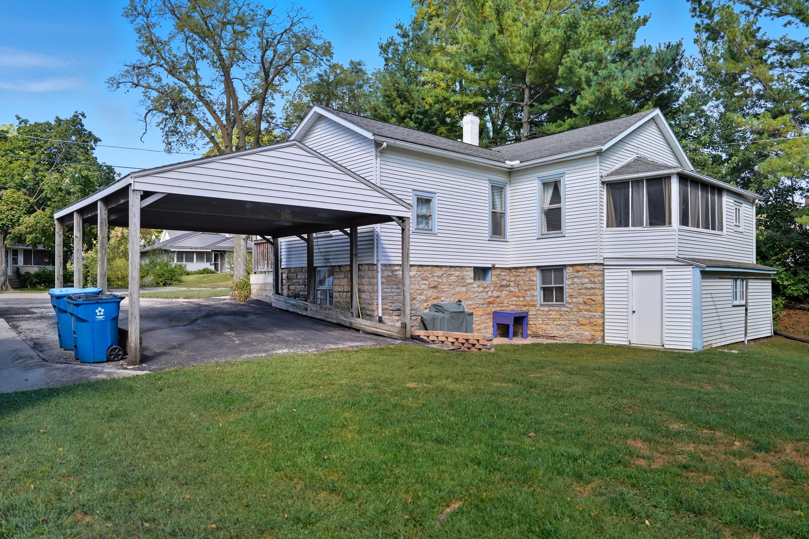 318 East McKenney Street Dixon, IL 61021 - Photo 6 of 36 a view of a house with a yard potted plants and a bench