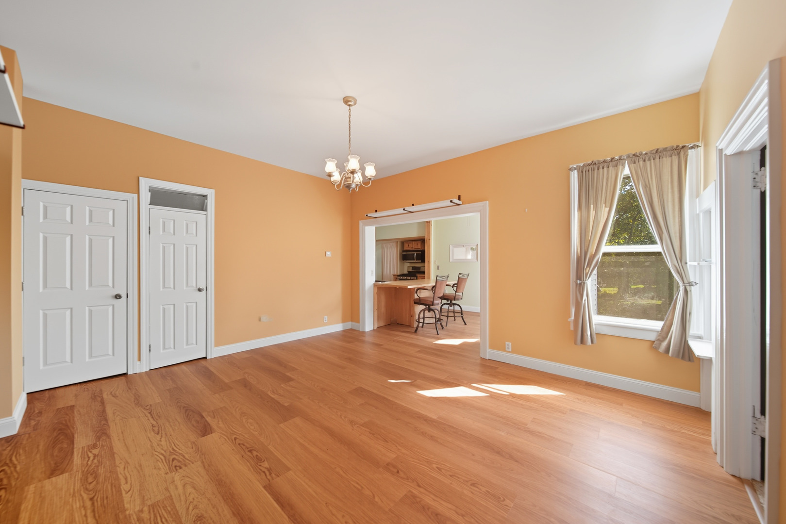318 East McKenney Street Dixon, IL 61021 - Photo 8 of 36 a view of a livingroom with a furniture wooden floor and chandelier