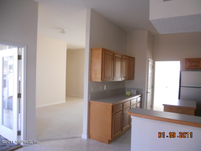 2911 Ravine Hill Drive Middleburg, FL 32068 - Photo 3 of 9 a kitchen with a sink and cabinets