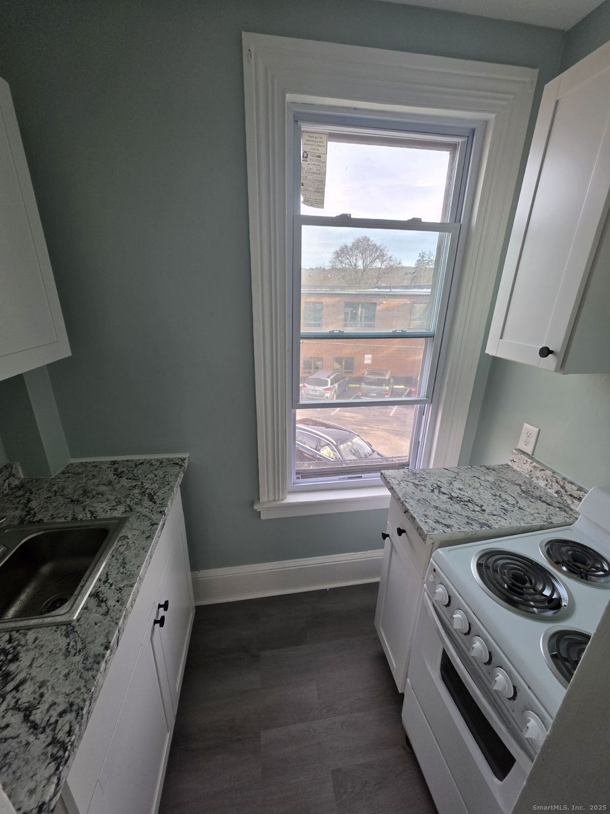 21 Pearl Street, Unit 2A Torrington, CT 06790 - Photo 3 of 4 a kitchen with a stove and a sink