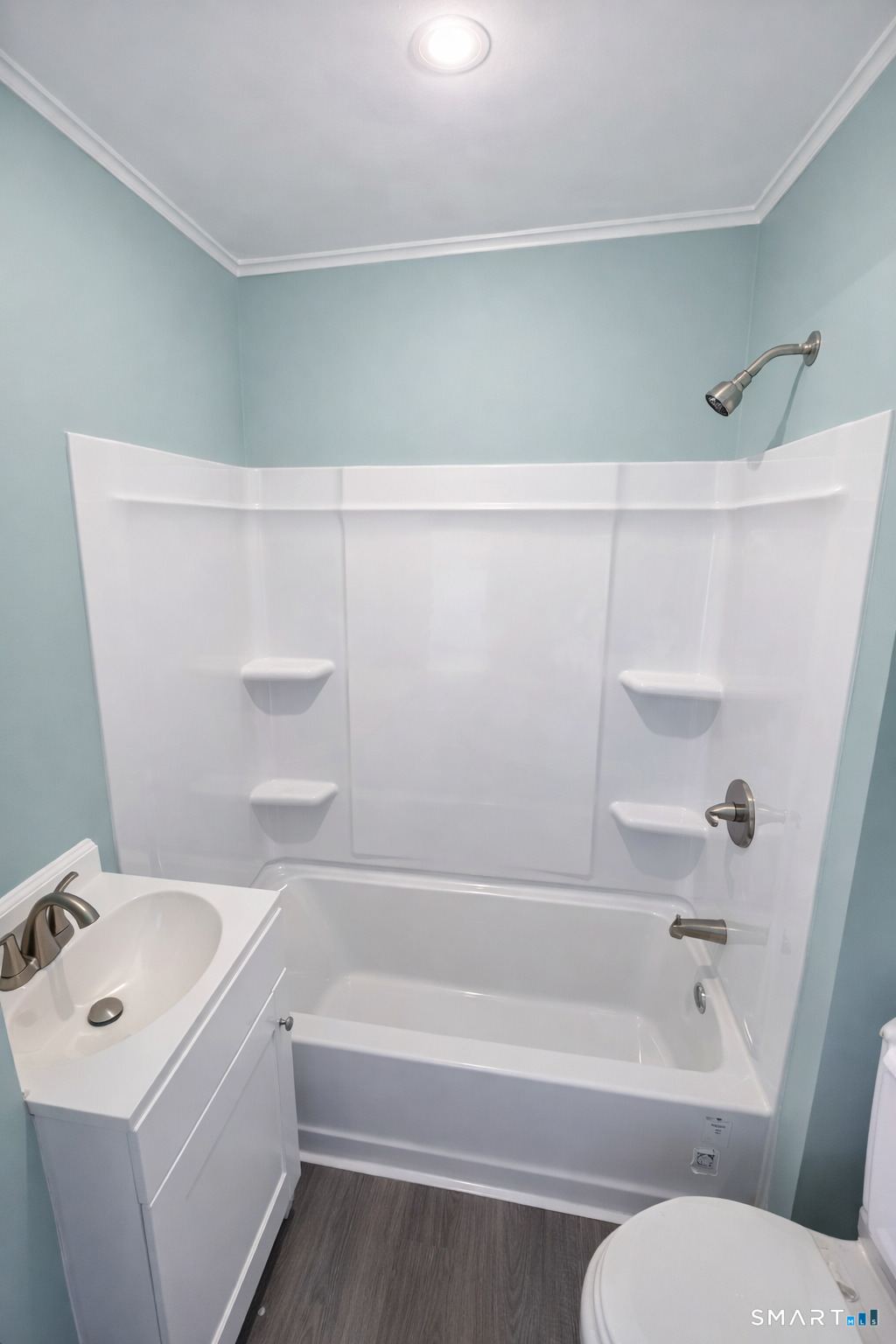21 Pearl Street, Unit 2A Torrington, CT 06790 - Photo 5 of 5 a bathroom with a sink a toilet and a bathtub