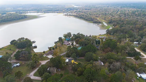 an aerial view of city and lake